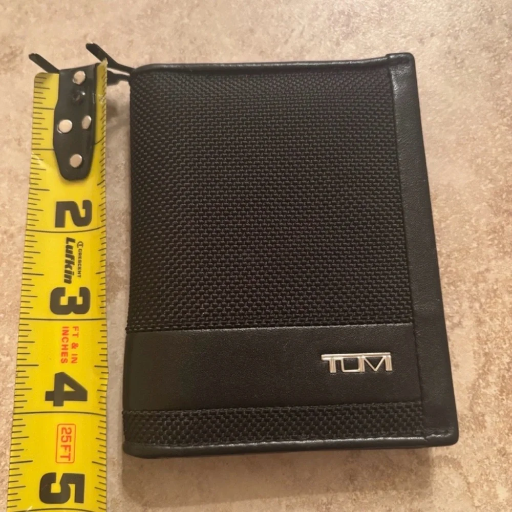 Tumi Black Textured Wallet new without tags in excellent condition